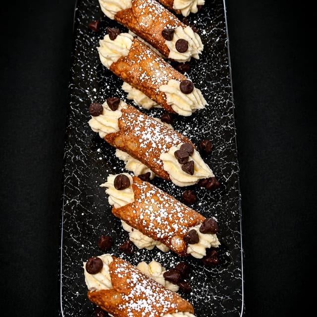 (2) Cannolis.